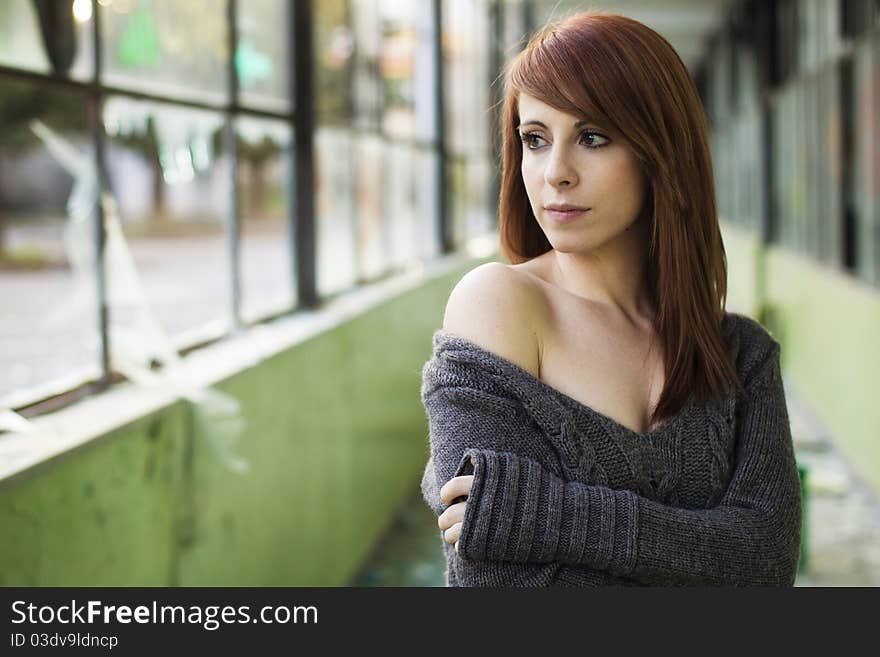 Young beautiful woman portrait in abandoned place