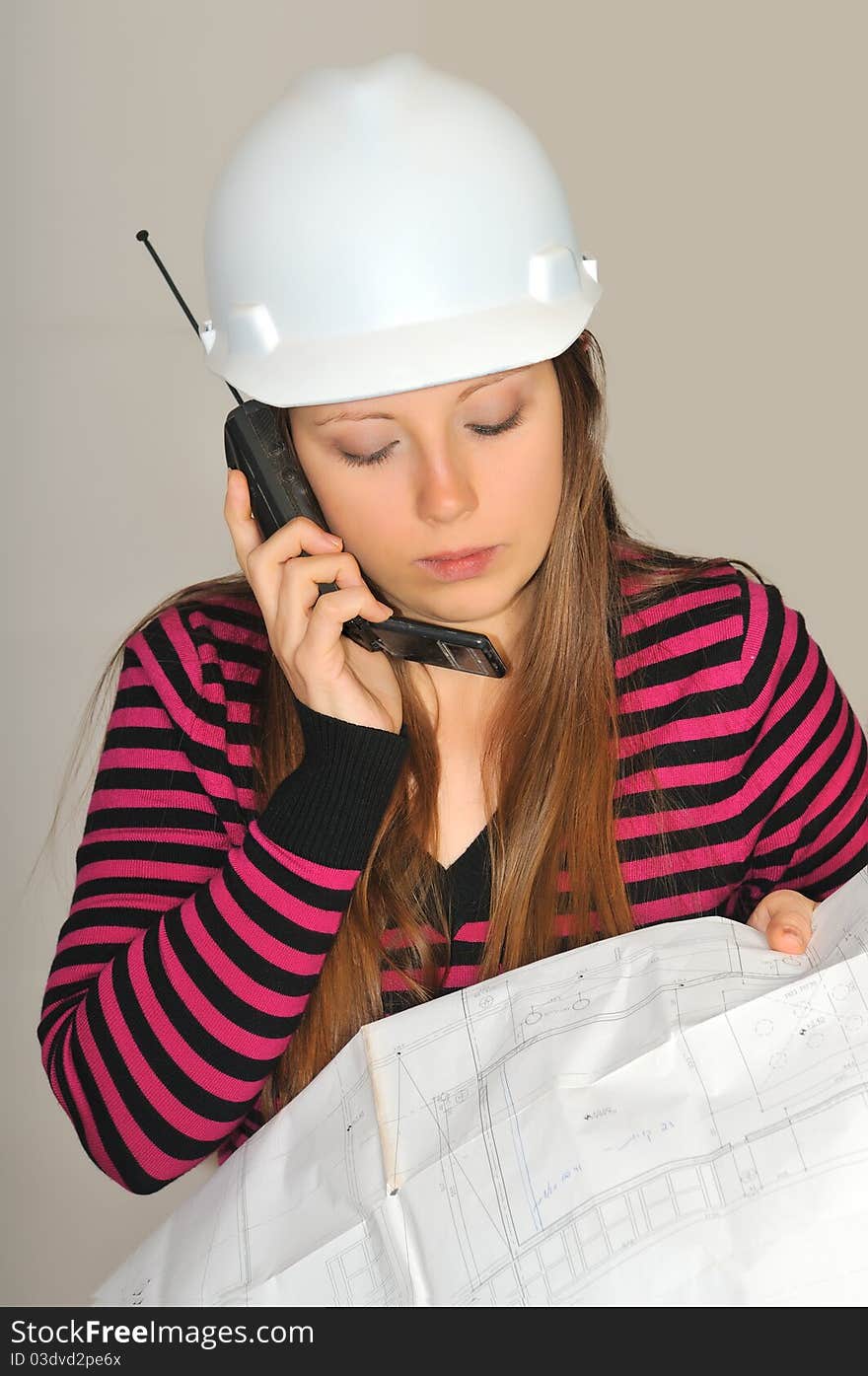 Girl with construction drawings