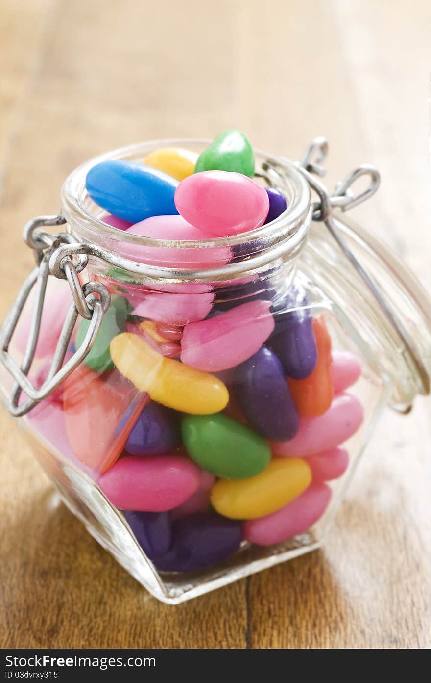 Colorful jelly beans in a bottle - very shallow depth of field