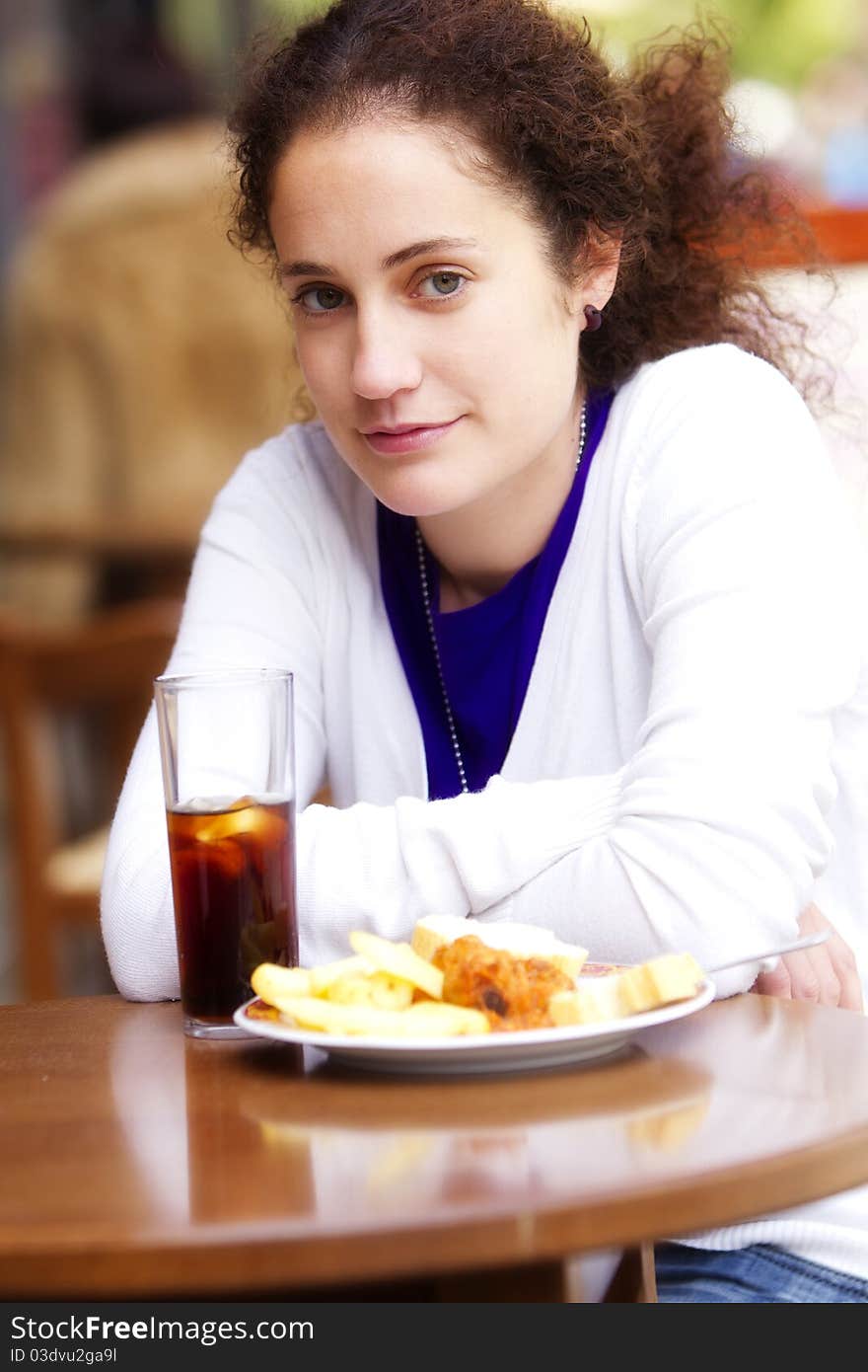 Young beautiful girl enjoying a soda outdoors. Young beautiful girl enjoying a soda outdoors