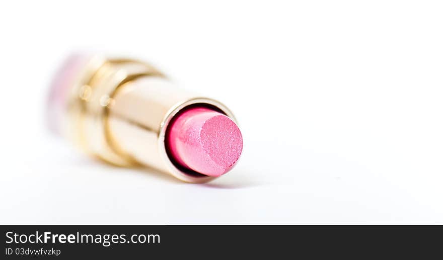 Open pink lipstick closeup isolated