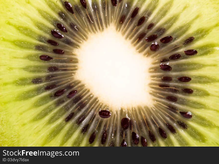 Of green vegetation Kiwi halved Close