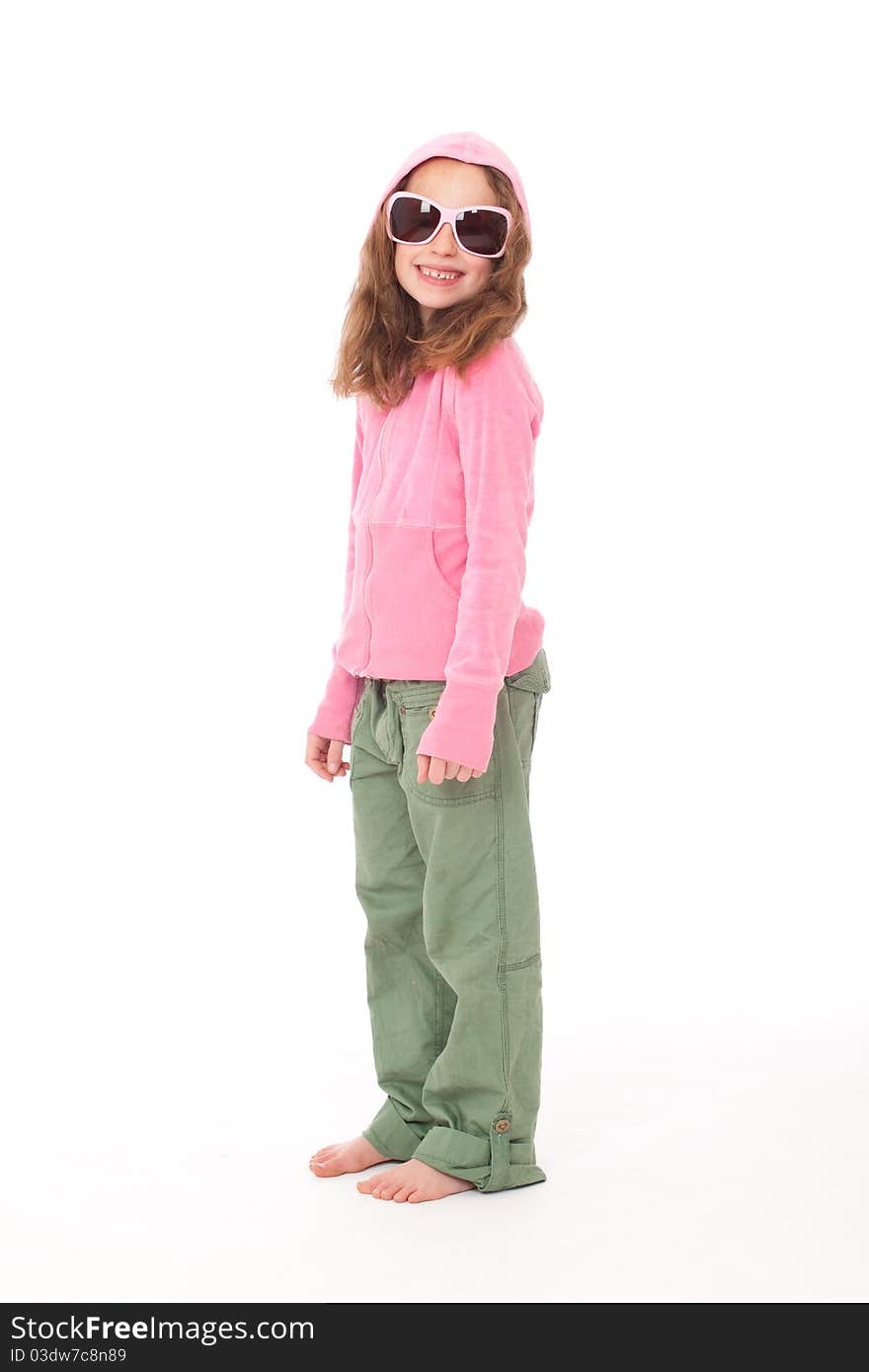 Young Girl Standing In Pink Top And Green Pants