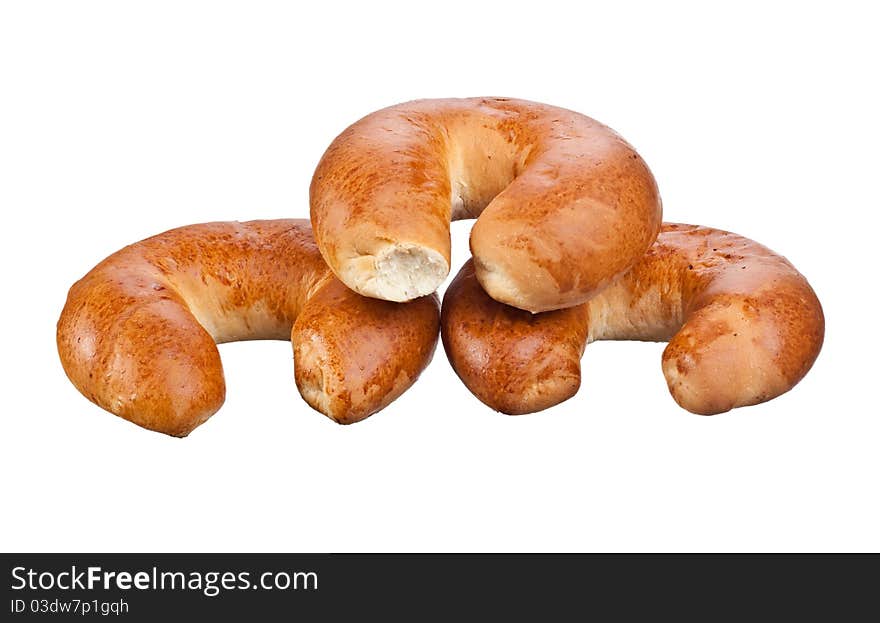 Whole wheat bagels isolated on white background.