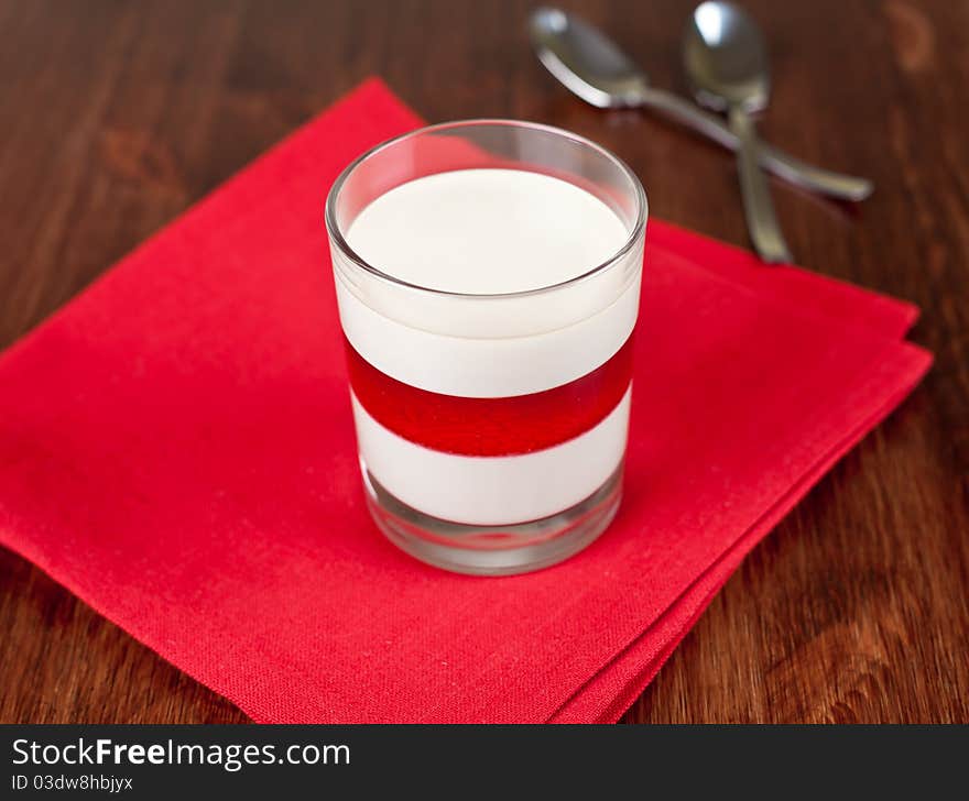 Coffee flavor panna cotta with fruit layer in the glass. Coffee flavor panna cotta with fruit layer in the glass