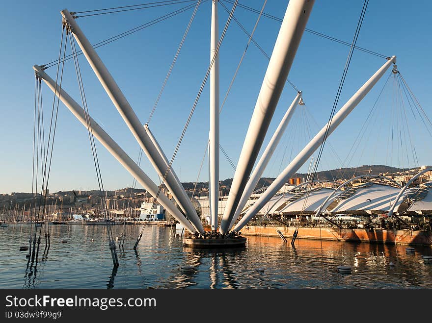 Derrick with reflections in the ancient port of Genoa