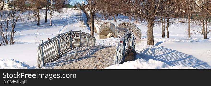 Bridges with the wedding castles in the city park. Bridges with the wedding castles in the city park