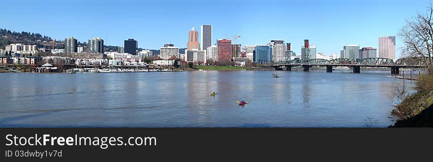 Kayaks on the Willamette river with the panorama of Portland OR. Kayaks on the Willamette river with the panorama of Portland OR.