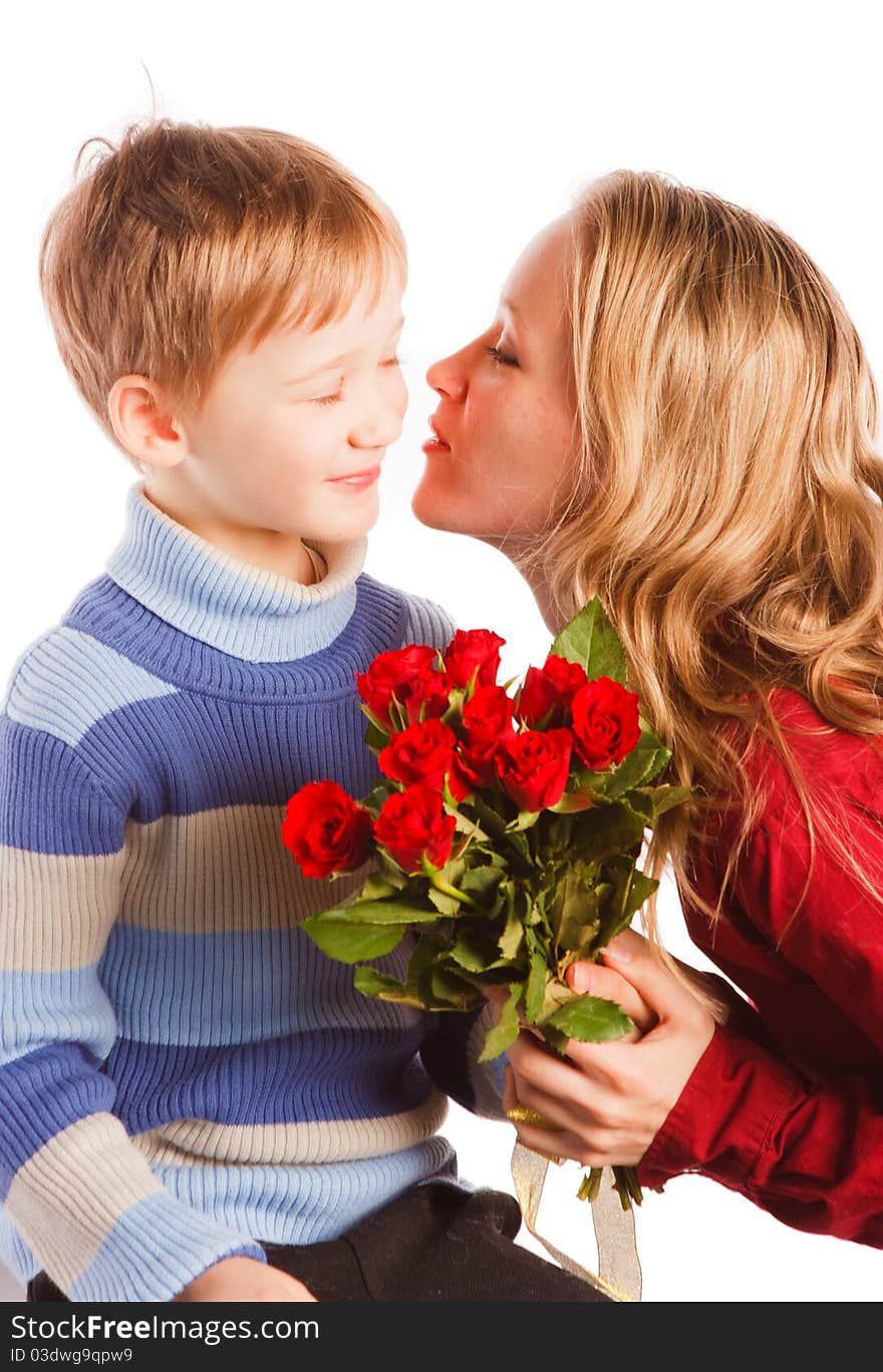 Charming  beautiful young woman with a son and with the bouquet of red roses on a white background