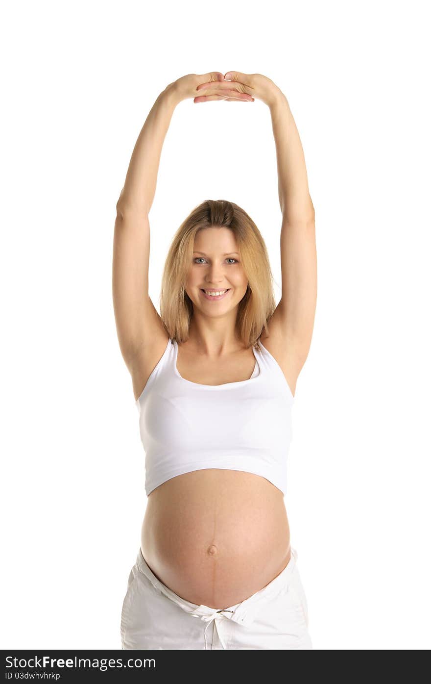 Pregnant woman practicing yoga isolated on white