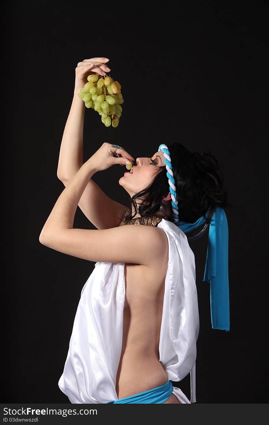 Ancient greece woman with a bunch of grapes