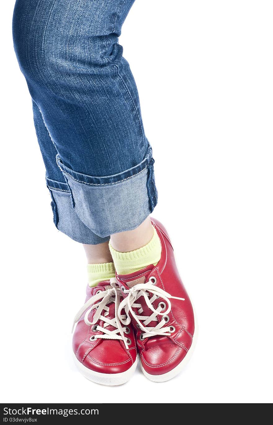 Woman showing off her new red leather running shoes, isolated on white. Woman showing off her new red leather running shoes, isolated on white.