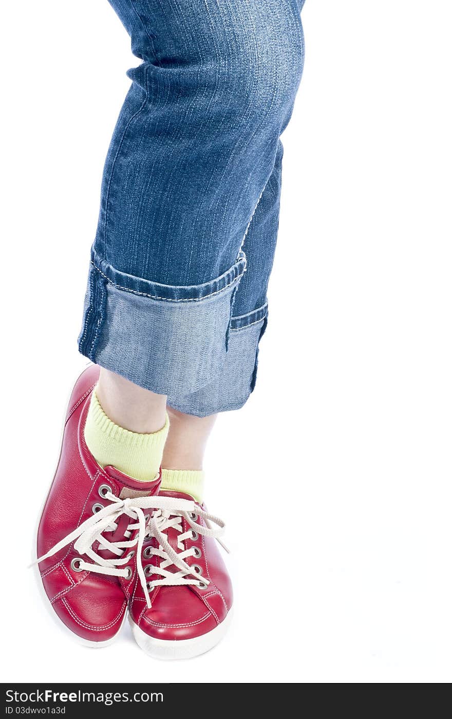 Woman showing off her new red leather running shoes, isolated on white. Woman showing off her new red leather running shoes, isolated on white.