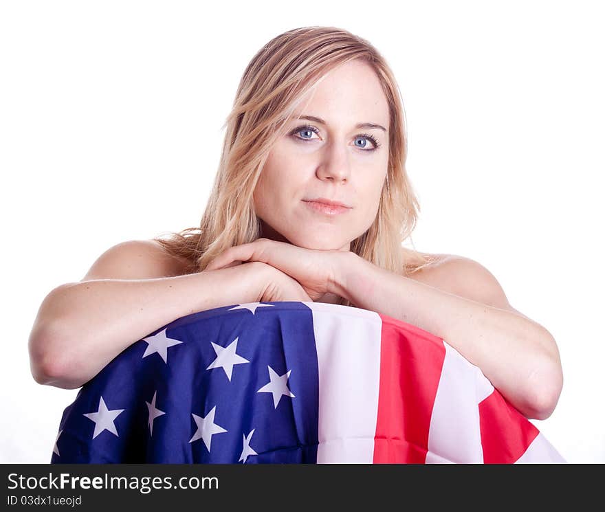 A cute girl poses with an American Flag. A cute girl poses with an American Flag