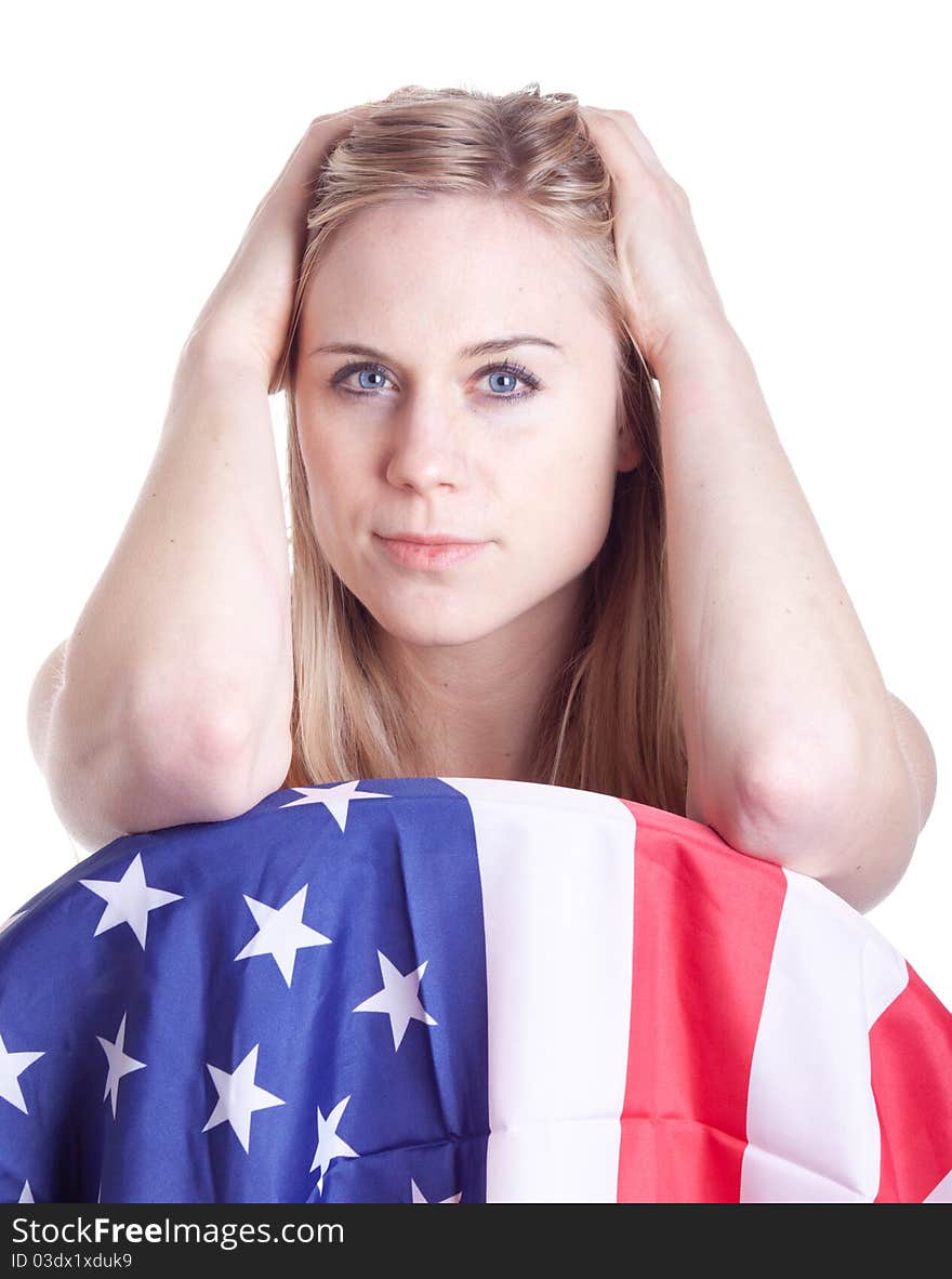 A hot girl pushes her hair back and poses with an American flag. A hot girl pushes her hair back and poses with an American flag.