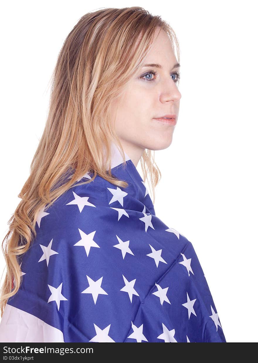 A blond girl has an American flag wrapped around her. A blond girl has an American flag wrapped around her.