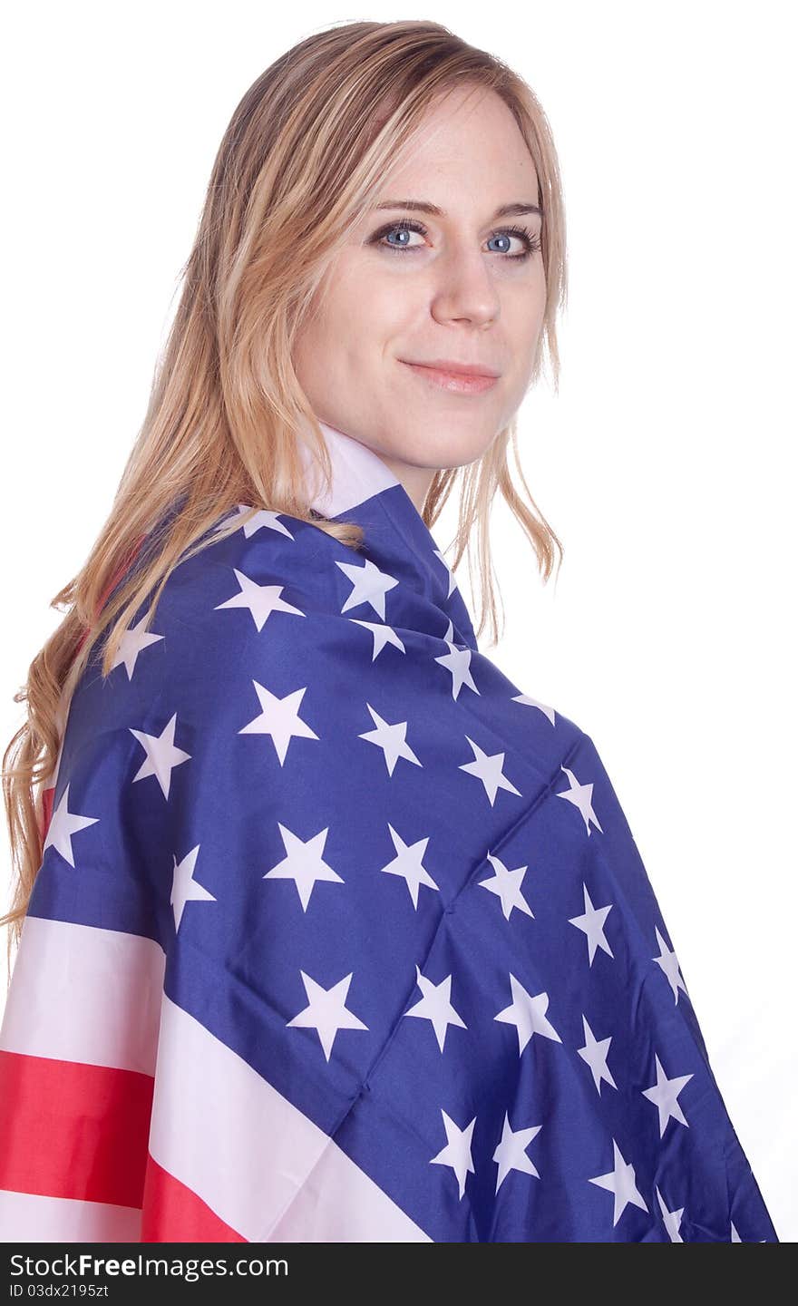 A girl is covered with an American flag. A girl is covered with an American flag.