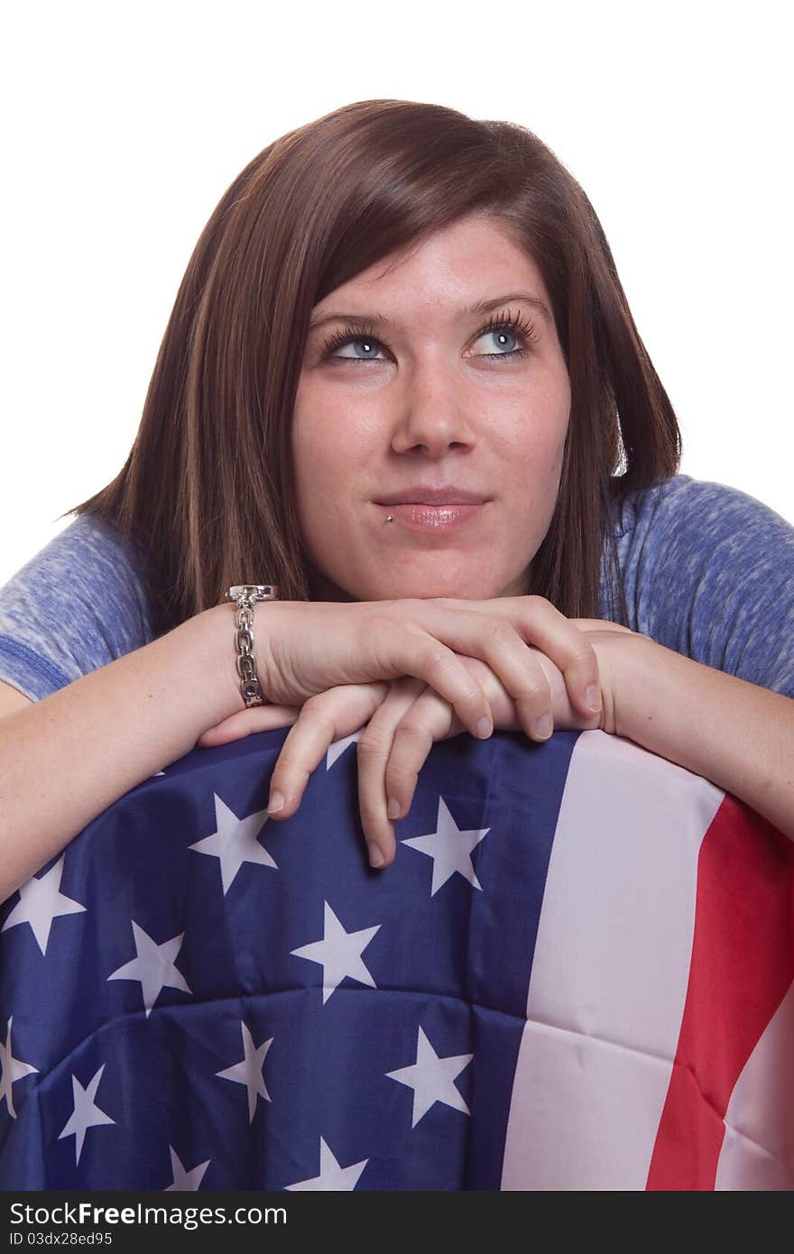 A cute girl poses with the American Flag. A cute girl poses with the American Flag