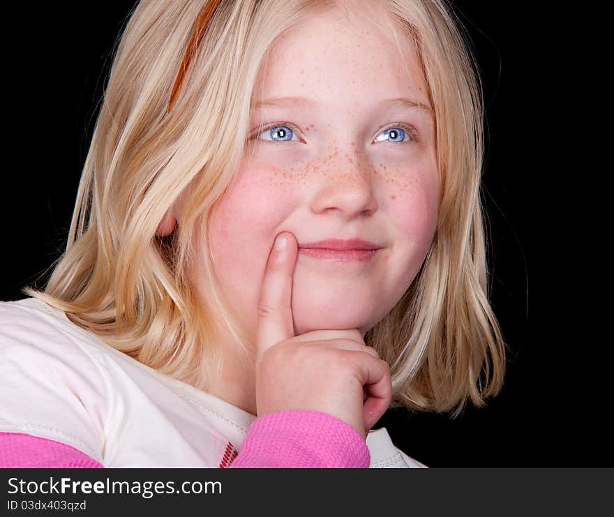 A nice image of a cute young girl thinking about what is going to happen today. A nice image of a cute young girl thinking about what is going to happen today.