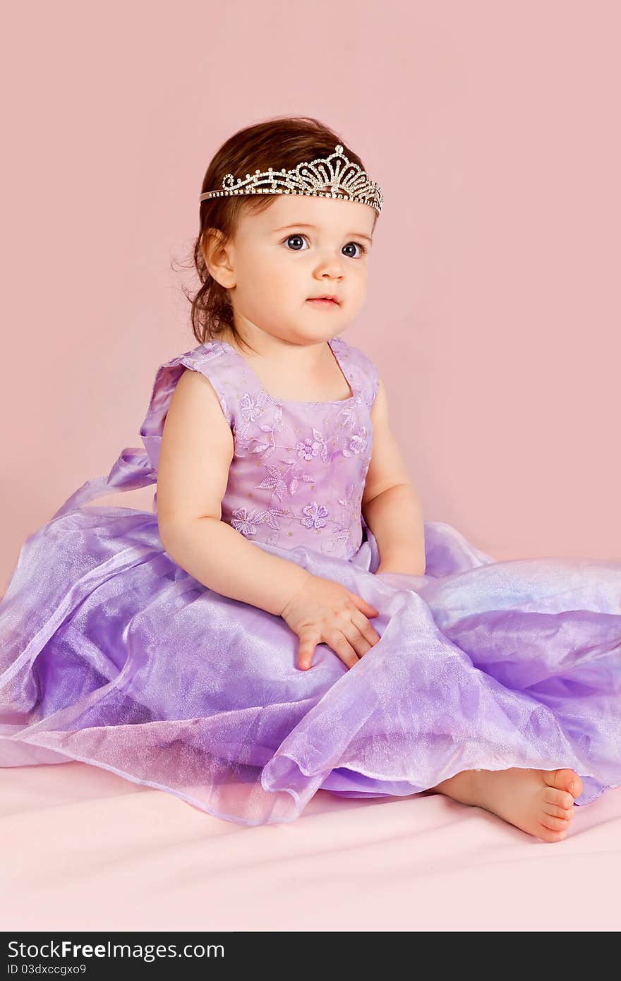 Portrait of the child on a pink background in studio. Portrait of the child on a pink background in studio