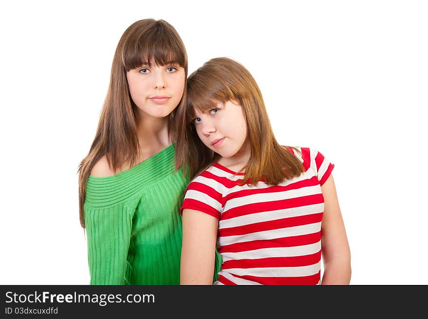 Portrait of two lovely sisters isolated on white background. Portrait of two lovely sisters isolated on white background