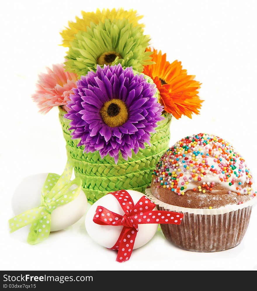 Easter still-life. Flowers, Easter eggs and cake