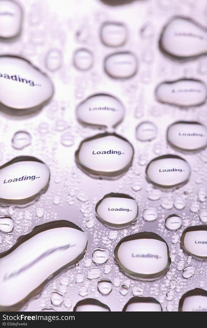 The word Loading... in water drops. Close-up of studo shot.