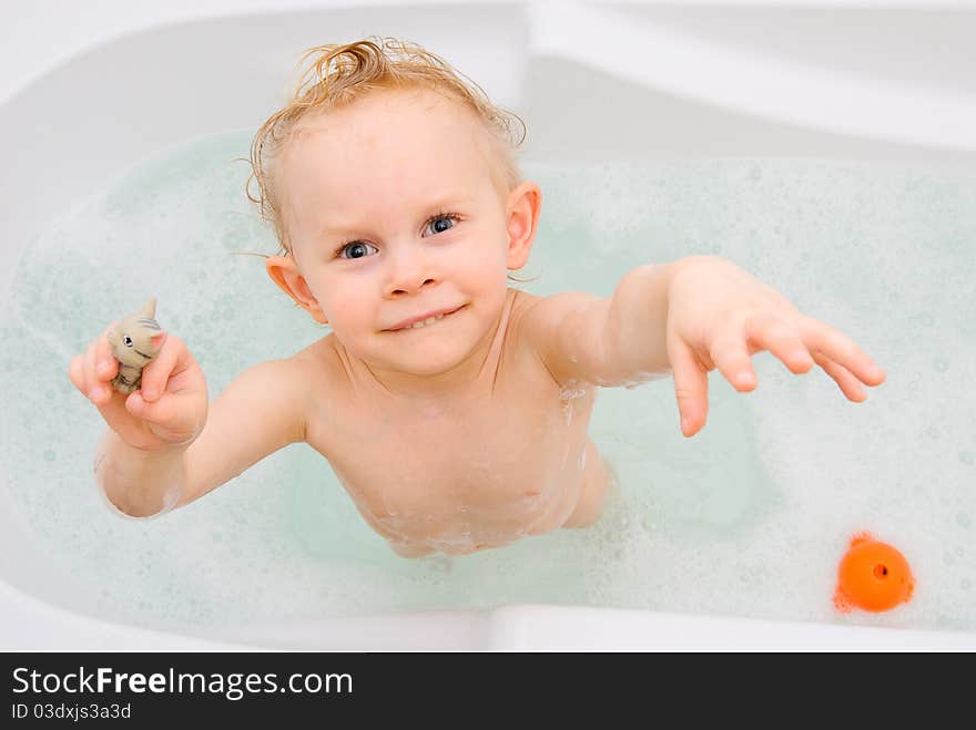 Cute 2 years old girl having bath fun