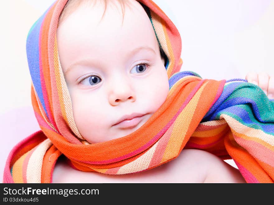 Cute 1 year child wrapped in baby sling. Cute 1 year child wrapped in baby sling