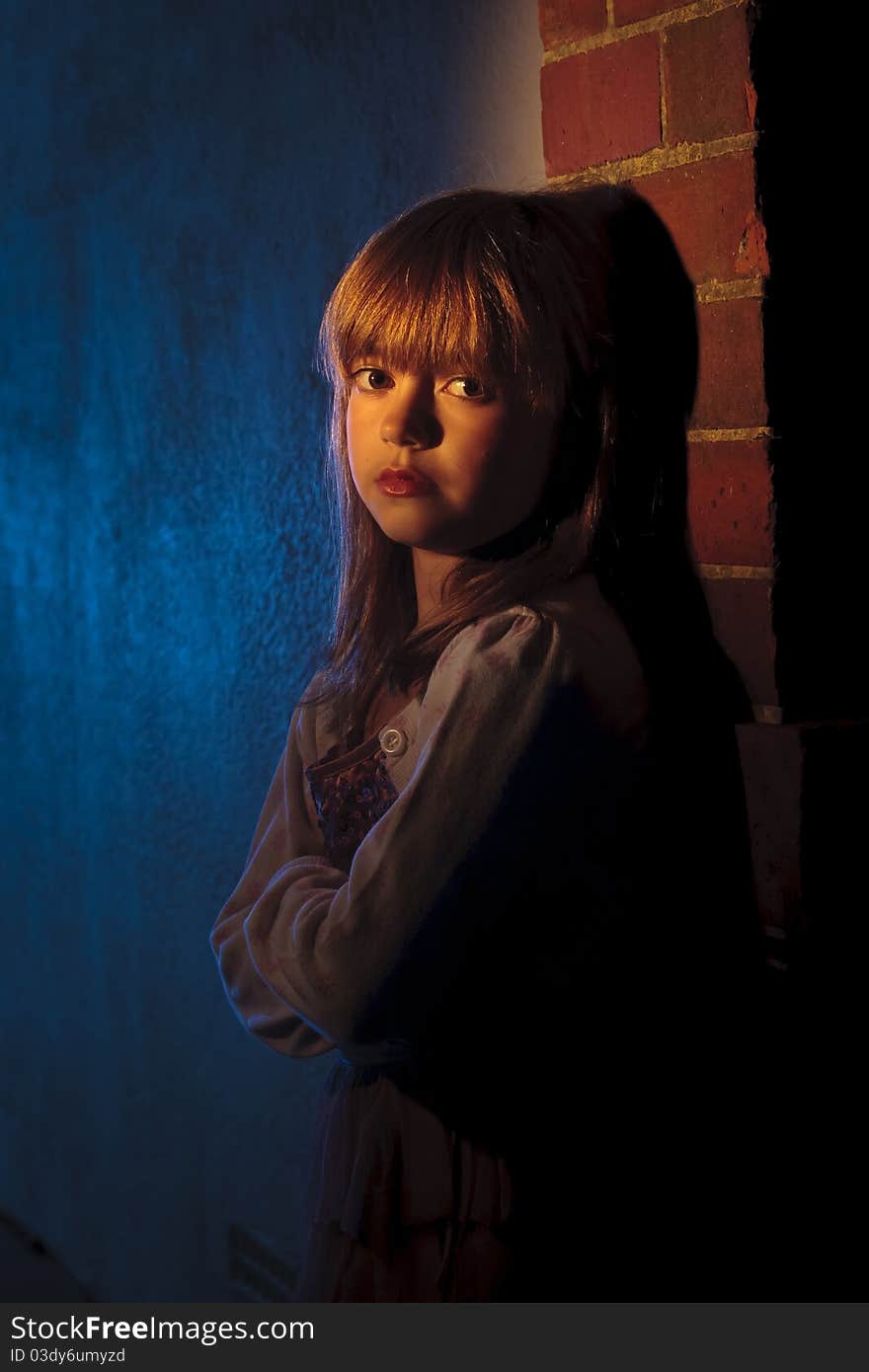 Girl with emotional expression leaning against a wall. Girl with emotional expression leaning against a wall