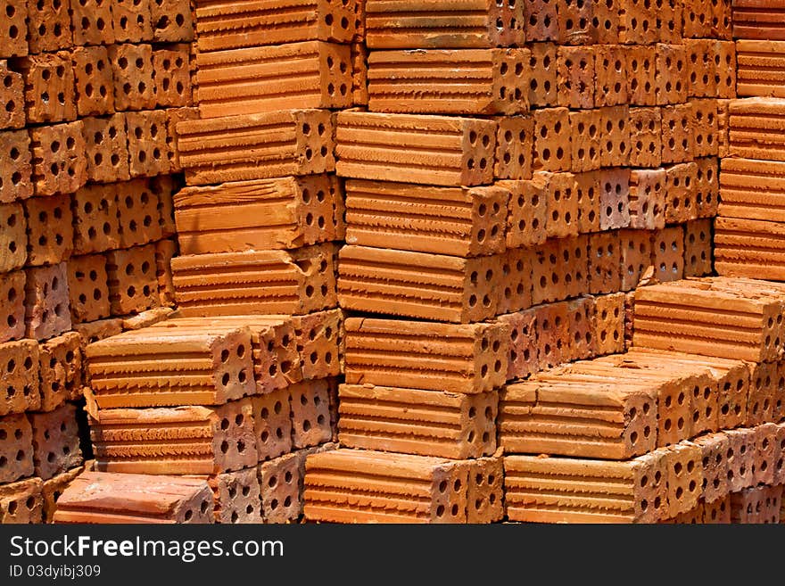 Orange brick wall is for the construction of buildings. Orange brick wall is for the construction of buildings.