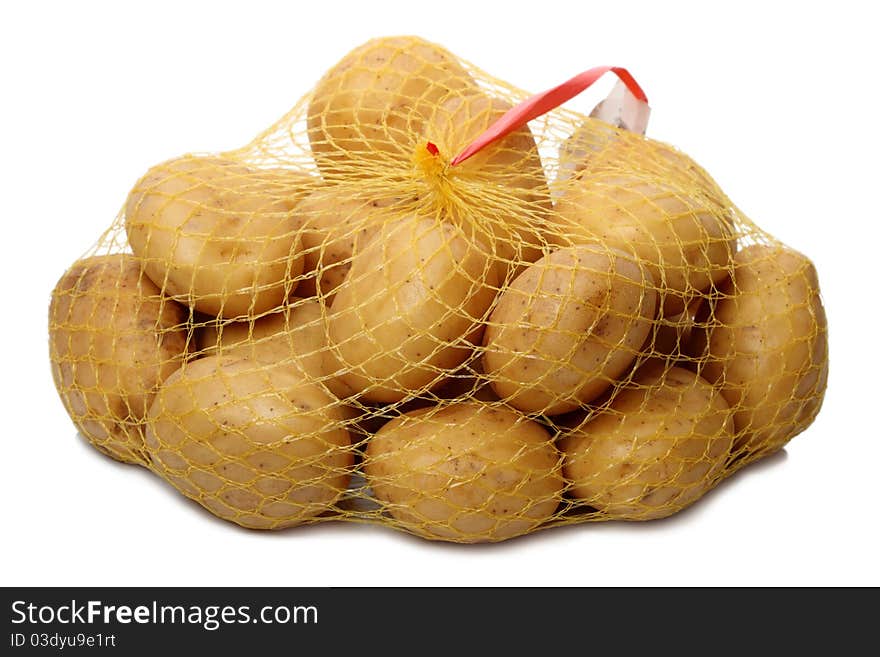 Mesh raw potatoes from the supermarket. Isolated on white background