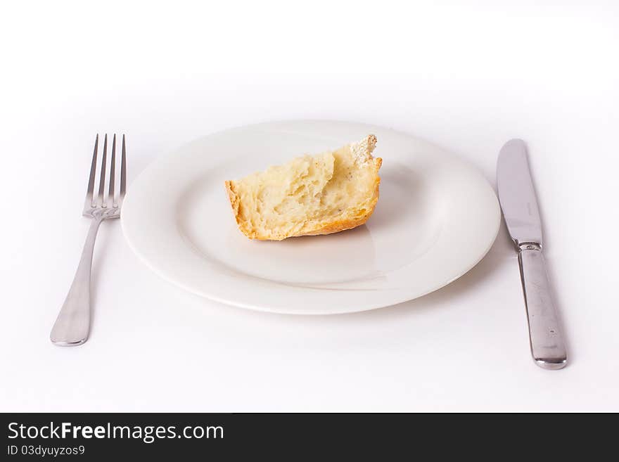 Bread on the plate with fork and knife