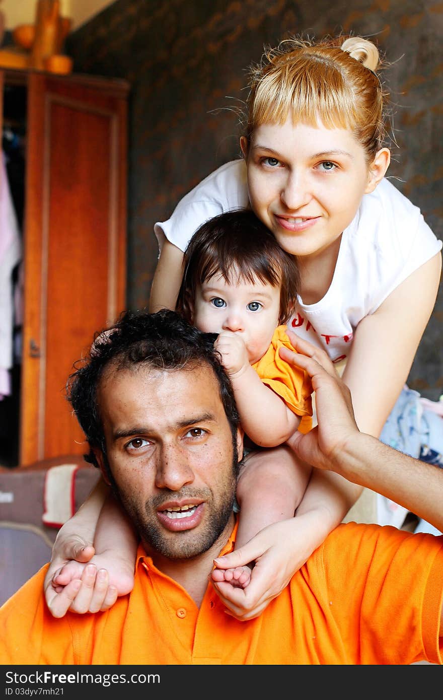 Baby with mother and father in the room. Baby with mother and father in the room