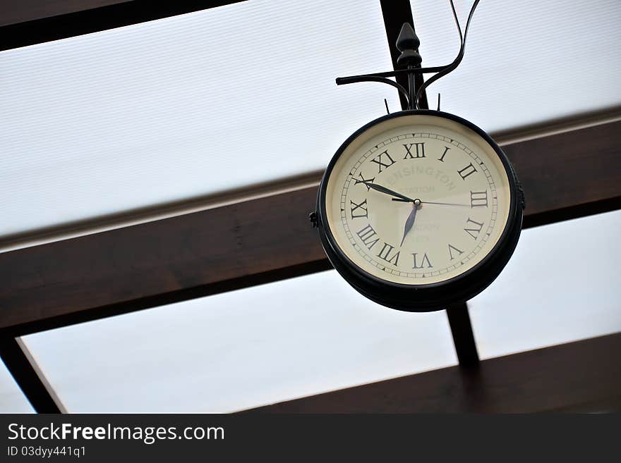 Antique clock on wall with London marking.