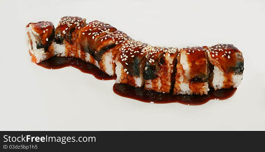 Tasty sushi set with fish, sause and sesame. Tasty sushi set with fish, sause and sesame