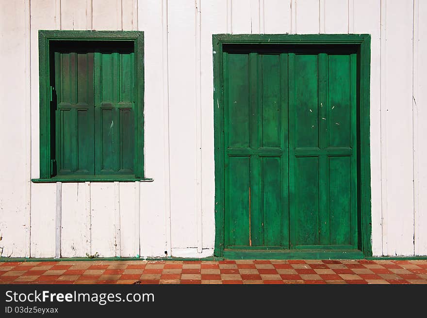 Old wooden door and window in a house in Nicaragua. Old wooden door and window in a house in Nicaragua.