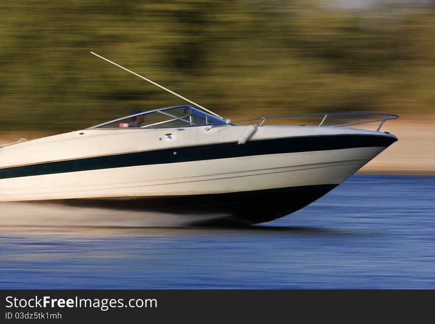 Speed motor boat is navigated on a river. Speed motor boat is navigated on a river