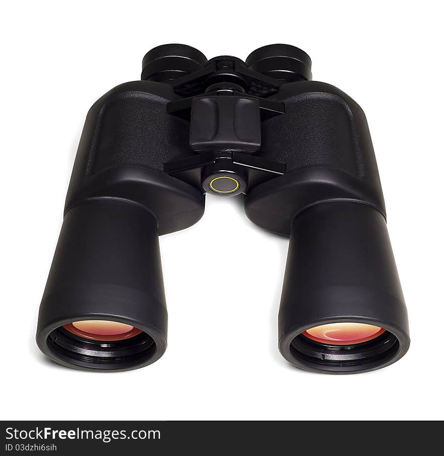 Binoculars with orange color reflection on lenses. Top view. Isolated on white background. Binoculars with orange color reflection on lenses. Top view. Isolated on white background