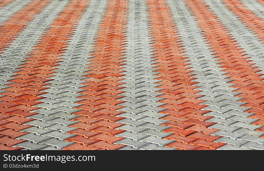 The terrace and a red stone is laid in rows