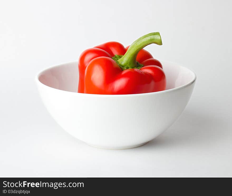 Fresh red Bulgarian pepper in a white bowl. Fresh red Bulgarian pepper in a white bowl