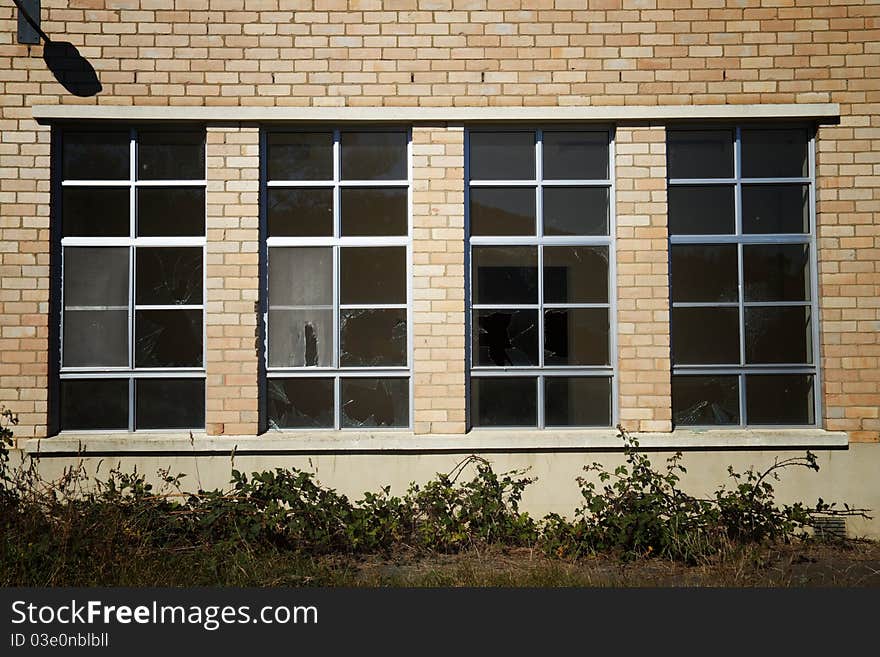 Broken window panes in deserted building at Willow Court, Tasmania. Broken window panes in deserted building at Willow Court, Tasmania.