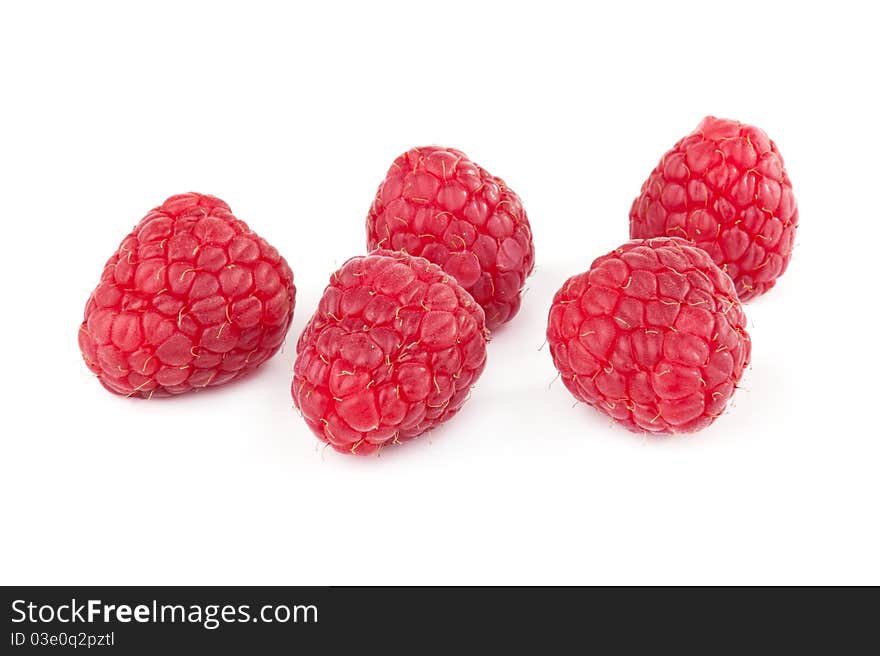 Ripe raspberries on white background