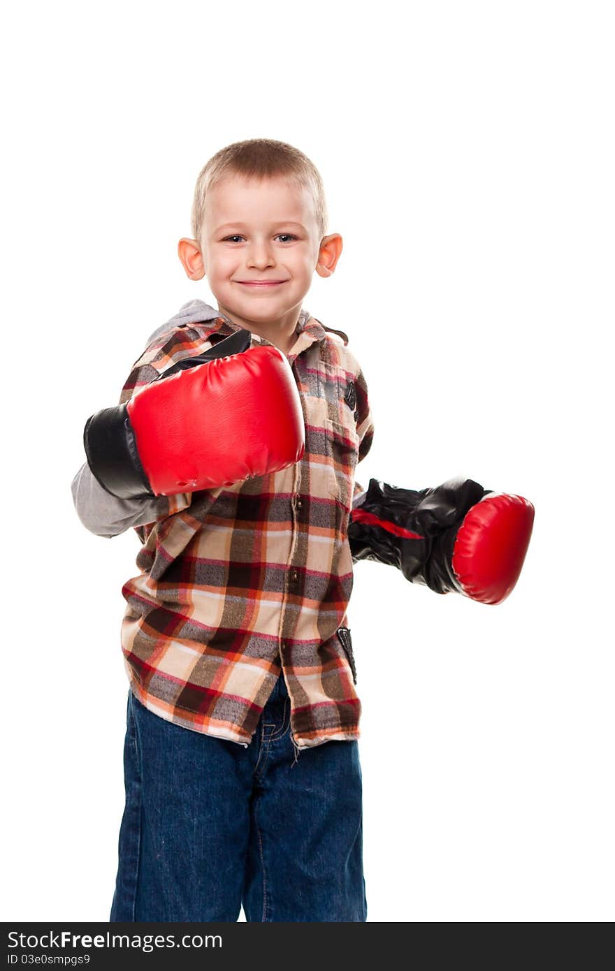 Cute boy in the boxing gloves isolated on white
