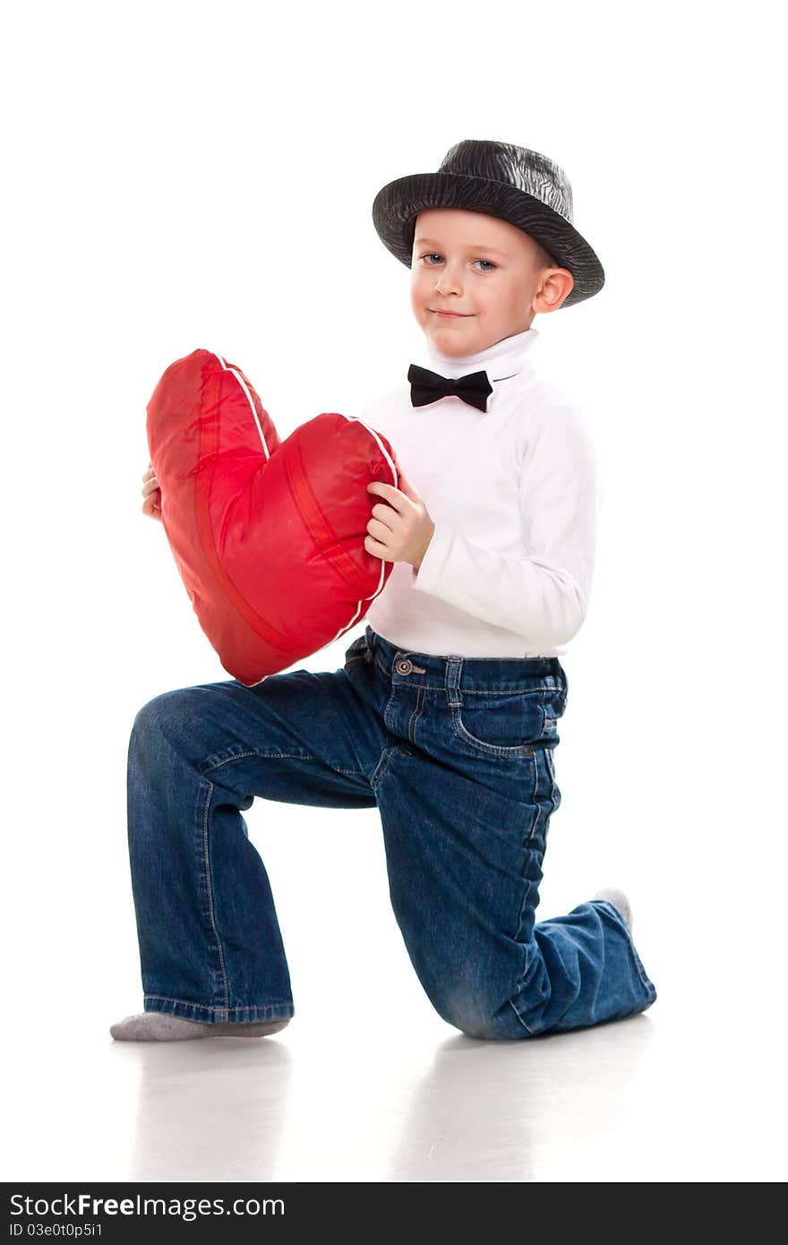 Cute boy with red heart isolated on white