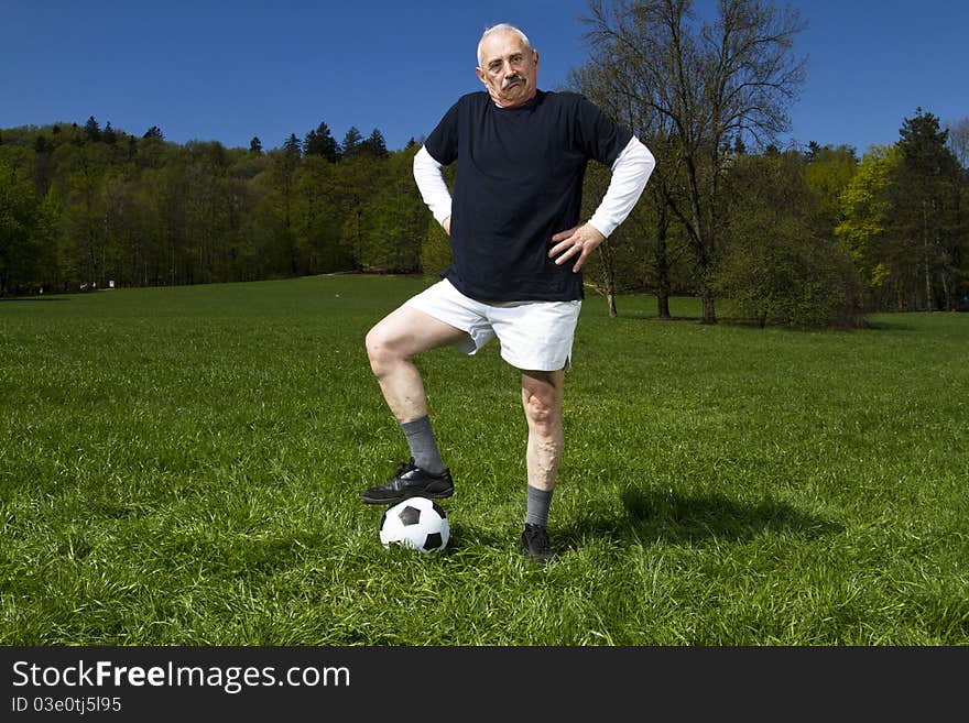 Senior football player in the park