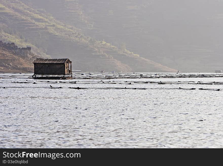 Woody House floats on the lake in Kunming, China. Woody House floats on the lake in Kunming, China.