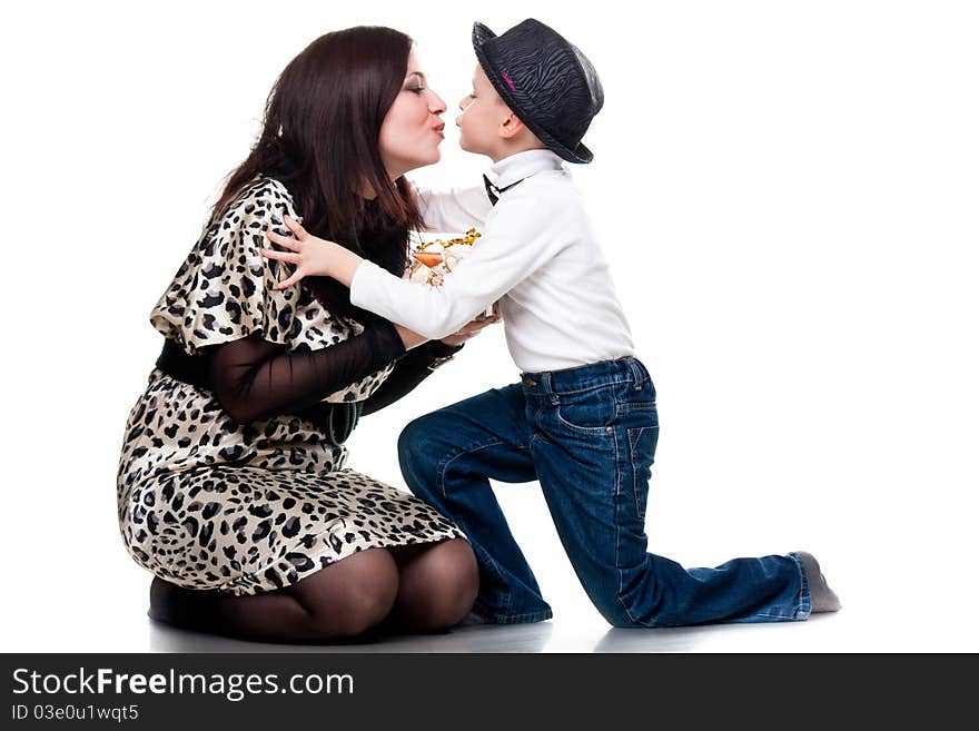 Cute boy kissing his mother isolated on white