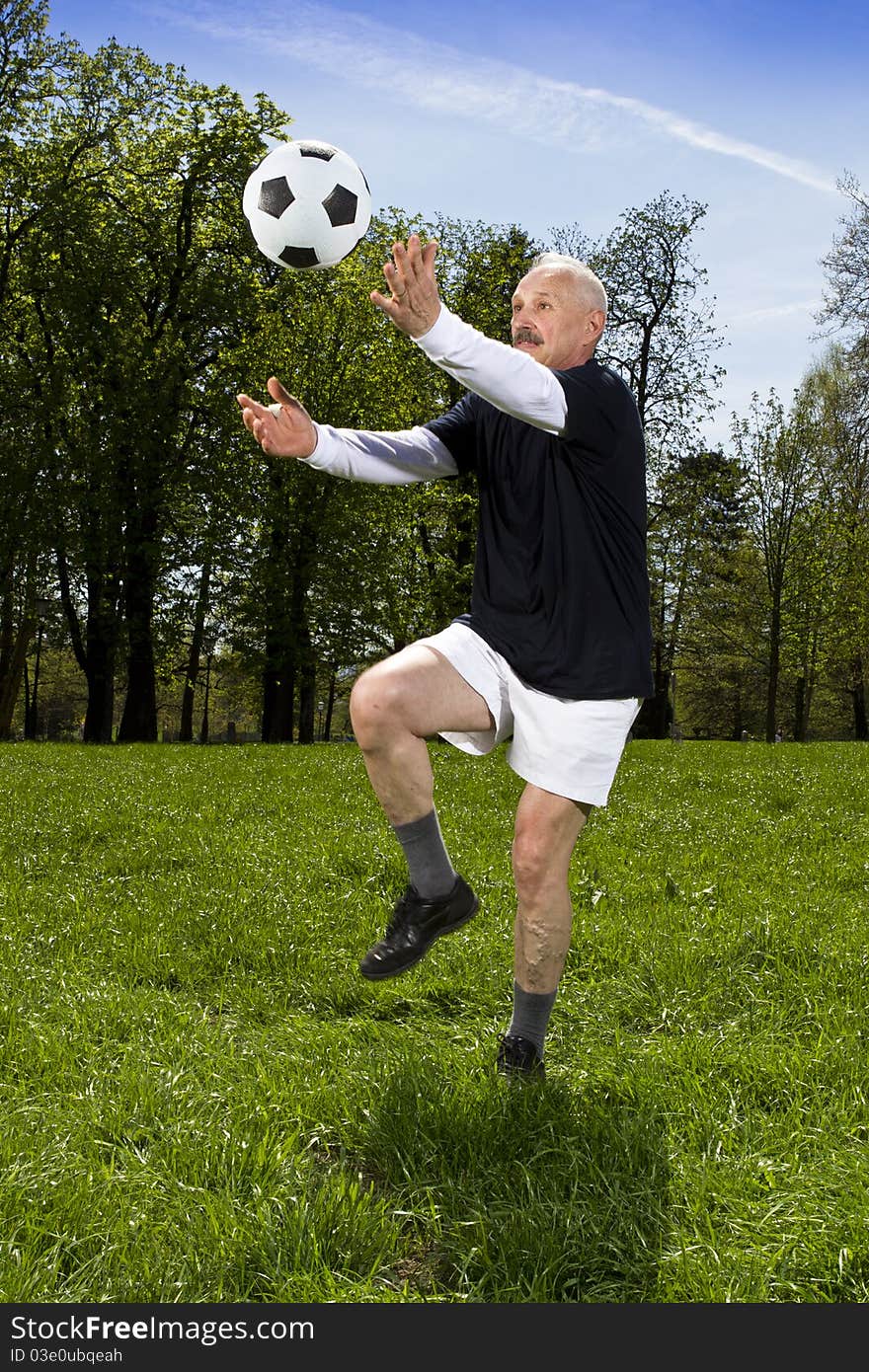 Senior football player in the park