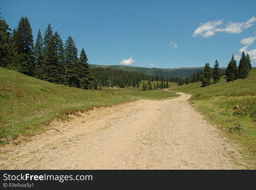 Winding Dirt Lane Ascending A Mountain